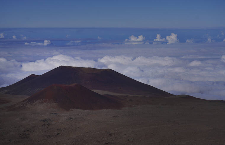 ASSOCIATED PRESS / JULY 15
                                The summit of Mauna Kea on the Big Island, on Saturday, July 15. Mauna Kea was born after a series of volcanic eruptions from the ocean floor created new land. Over a million years, it grew into the tallest mountain on earth when measured from its base in the Pacific Ocean to its summit soaring 13,796 feet (4,205 meters) above sea level.