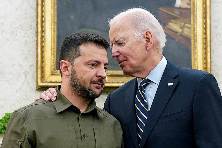 REUTERS/KEVIN LAMARQUE / 2023 
                                Ukrainian President Volodymyr Zelenskiy is embraced by U.S. President Joe Biden in the Oval Office of the White House in Washington.