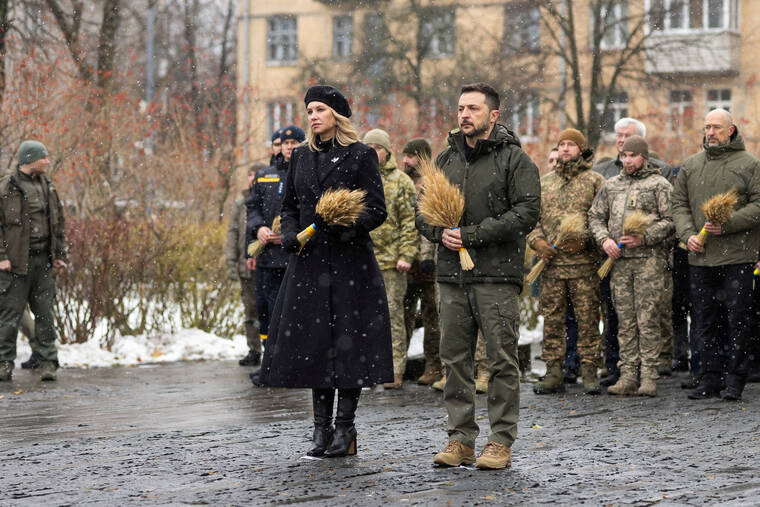 UKRAINIAN PRESIDENTIAL PRESS SERVICE / via REUTERS
                                Ukraine’s President Volodymyr Zelenskyy and first lady Olena Zelenska visit a monument to Holodomor victims during a commemoration ceremony of the famine of 1932-33, in which millions died of hunger, in Kyiv, Ukraine, today. The ceremony took place amid Russia’s attack on Ukraine.