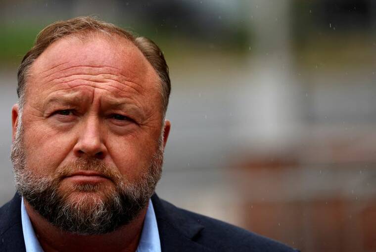 REUTERS/MIKE SEGAR/FILE PHOTO
                                Infowars founder Alex Jones arrives to speak to the media after appearing at his Sandy Hook defamation trial at Connecticut Superior Court in Waterbury, Conn., in October 2022.