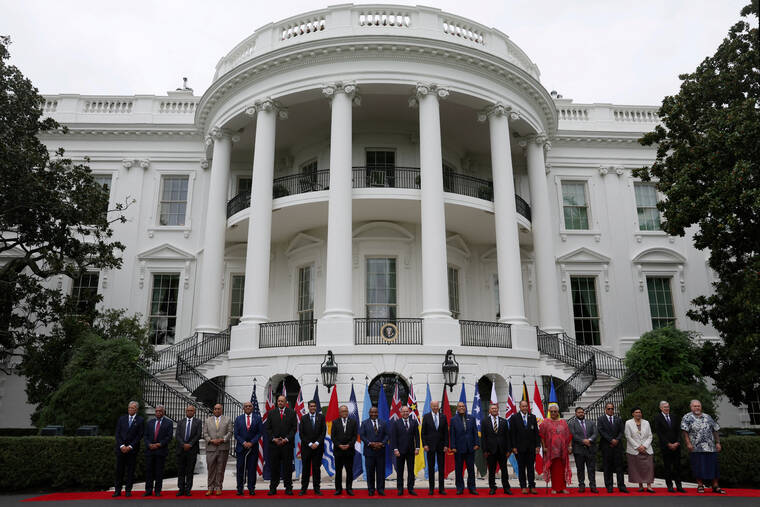 REUTERS/LEAH MILLIS/FILE PHOTO
                                Pacific island nation leaders pose for a group photograph with President Joe Biden during a summit at the White House in Washington, in September 2023. Pacific island nations at the center of a strategic rivalry between the U.S. and China that brought infrastructure and funding hope President-elect Donald Trump stays engaged in the region but are wary of competition spilling into confrontation, diplomats say.