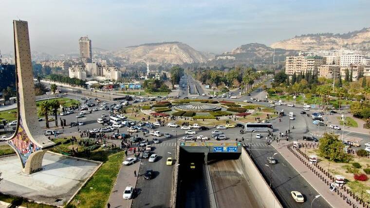 REUTERS/MAHMOUD HASSANO
                                A drone view shows vehicles on the street in Damascus after Syrian rebels ousted President Bashar al-Assad, today.