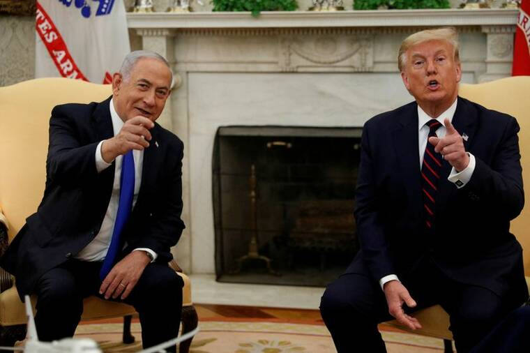 REUTERS/TOM BRENNER / 2020 
                                Israel’s Prime Minister Benjamin Netanyahu meets with U.S. President Donald Trump prior to signing the Abraham Accords, normalizing relations between Israel and some of its Middle East neighbors in a strategic realignment of Middle Eastern countries against Iran, during a meeting in the Oval Office at the White House in Washington.