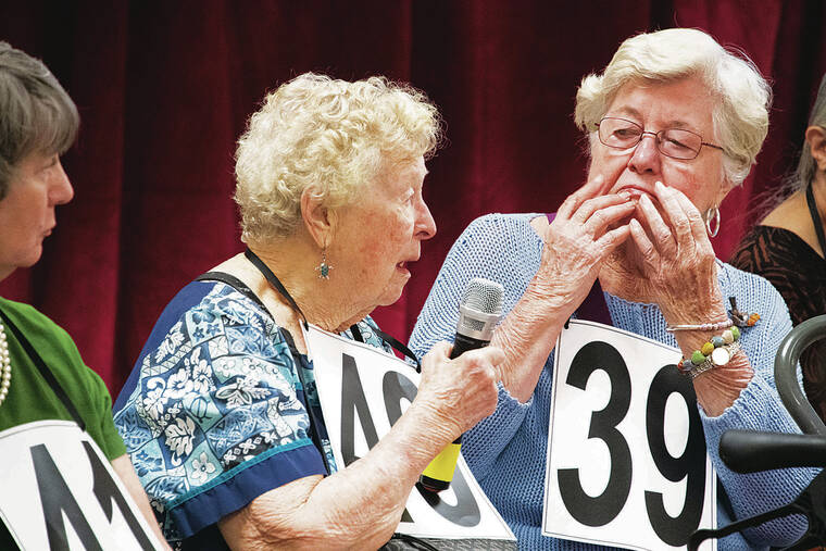 CRAIG T. KOJIMA / CKOJIMA@STARADVERTISER.COM
                                104-year-old Lucile Mistysn, middle, spelled her word in the first round.