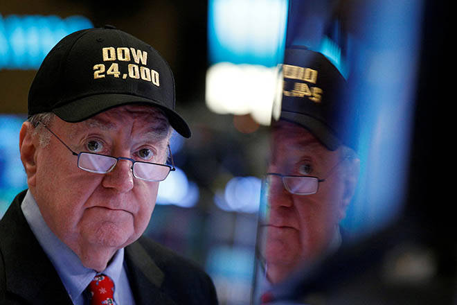 BRENDAN McDERMID / REUTERS / NOV. 30, 2017
                                Art Cashin, director of floor operations at UBS, wears a Dow 24,000 hat as he works on the floor of the New York Stock Exchange as the Dow Jones Industrial Average crosses 24,000 in 2017.