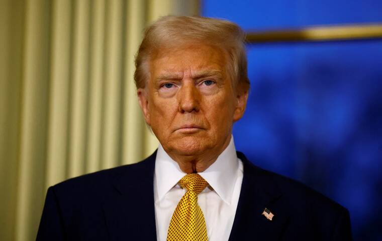 REUTERS/SARAH MEYSSONNIER/POOL/FILE PHOTO
                                President-elect Donald Trump attends a meeting with French President Emmanuel Macron at the Elysee Palace in Paris as part of ceremonies to mark the reopening of the Notre-Dame de Paris Cathedral, five-and-a-half years after a fire ravaged the Gothic masterpiece, in Paris, France, on Dec. 7. Trump said “anything can happen” when asked about the chances of going to war with Iran during his next term in an interview with Time, coinciding with his being named the magazine’s Person of the Year.