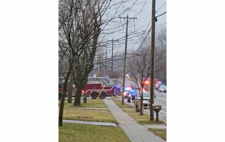 SABRINA RINGQUIST/TMX VIA REUTERS
                                Emergency vehicles are parked, following a call about a shooting, at the Abundant Life Christian School in Madison, Wis., today, in this screengrab obtained from social media video.