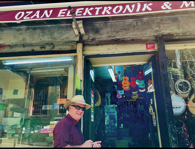 Honolulu resident Chris Coggins discovered ukulele in a rainbow of colors inside a music story in Istanbul, Turkey. Photo by Nancy Coggins.