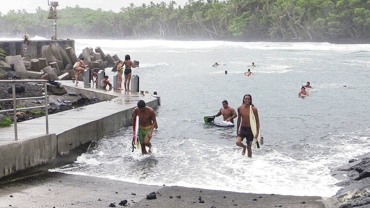 STAR-ADVERTISER / 2014
                                Prior to the 2018 Kilauea eruption, Pohoiki Beach was a popular spot for swimmers, surfers and companies operating lava ocean tours. Surfers and onlookers enjoy the high surf at Pohoiki Beach.