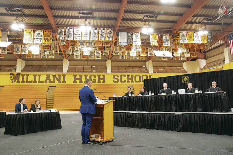 GEORGE F. LEE / GLEE@STARADVERTISER.COM
                                Supreme Court of the State of Hawaii made an appearance in the Mililani High School gym on Tuesday, Dec. 10, 2024 to hear the case of Blosson Bell v Hawaii Public Housing Authority. The sitting justices were Lisa M. Ginoza, left, Sabrina S. McKenna, Chief Justice Mark Recktenwald, Todd W. Eddins and Vladimir P. Devens. Klemen Urbanc, Deputy Attorneys General addessed the court.