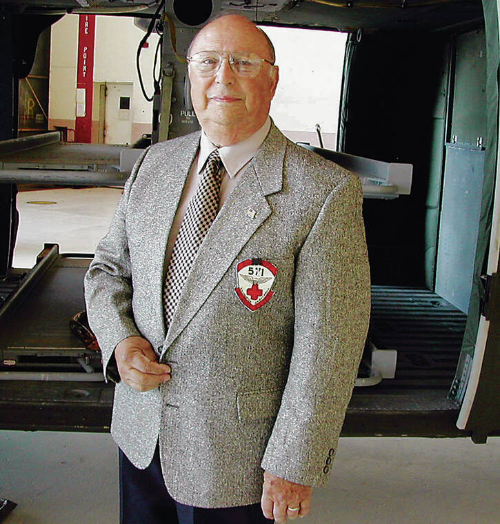 COURTESY PHOTO
                                Vince Cedola poses wearing a blazer with a 571st Medical Detachment patch.