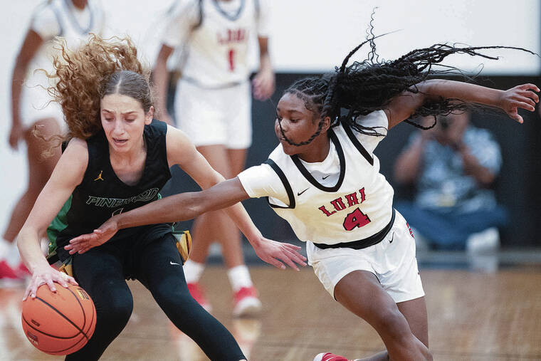 GEORGE F. LEE / GLEE@STARADVERTISER.COM
                                Long Island Lutheran Crusaders Taylor Brown was looking for a steal against Pinewood Panthers Caitlyn Kramer during an Iolani Girls basketball game on Friday at Iolani Gym.