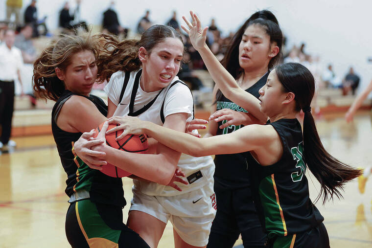 GEORGE F. LEE / GLEE@STARADVERTISER.COM
                                Long Island Lutheran Crusaders Emily McDonald is surrounded by Pinewood Panthers Vallory Kuelker, left, Jolyn Ding and Abigail Yew during an Iolani Girls basketball game on Friday at Iolani Gym.